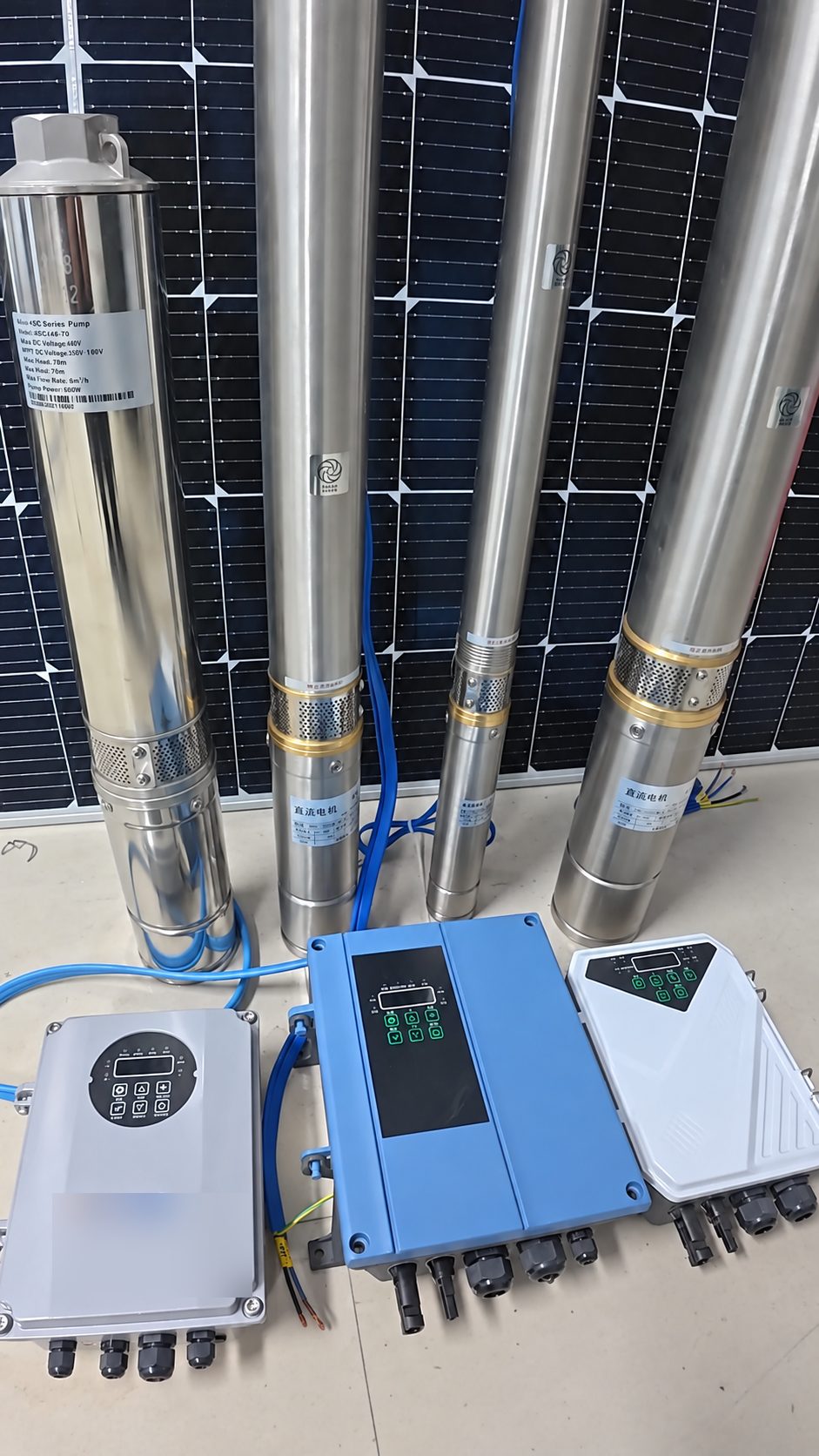 DC solar submersible pumps with three MPPT solar pump controllers in front of a solar panel