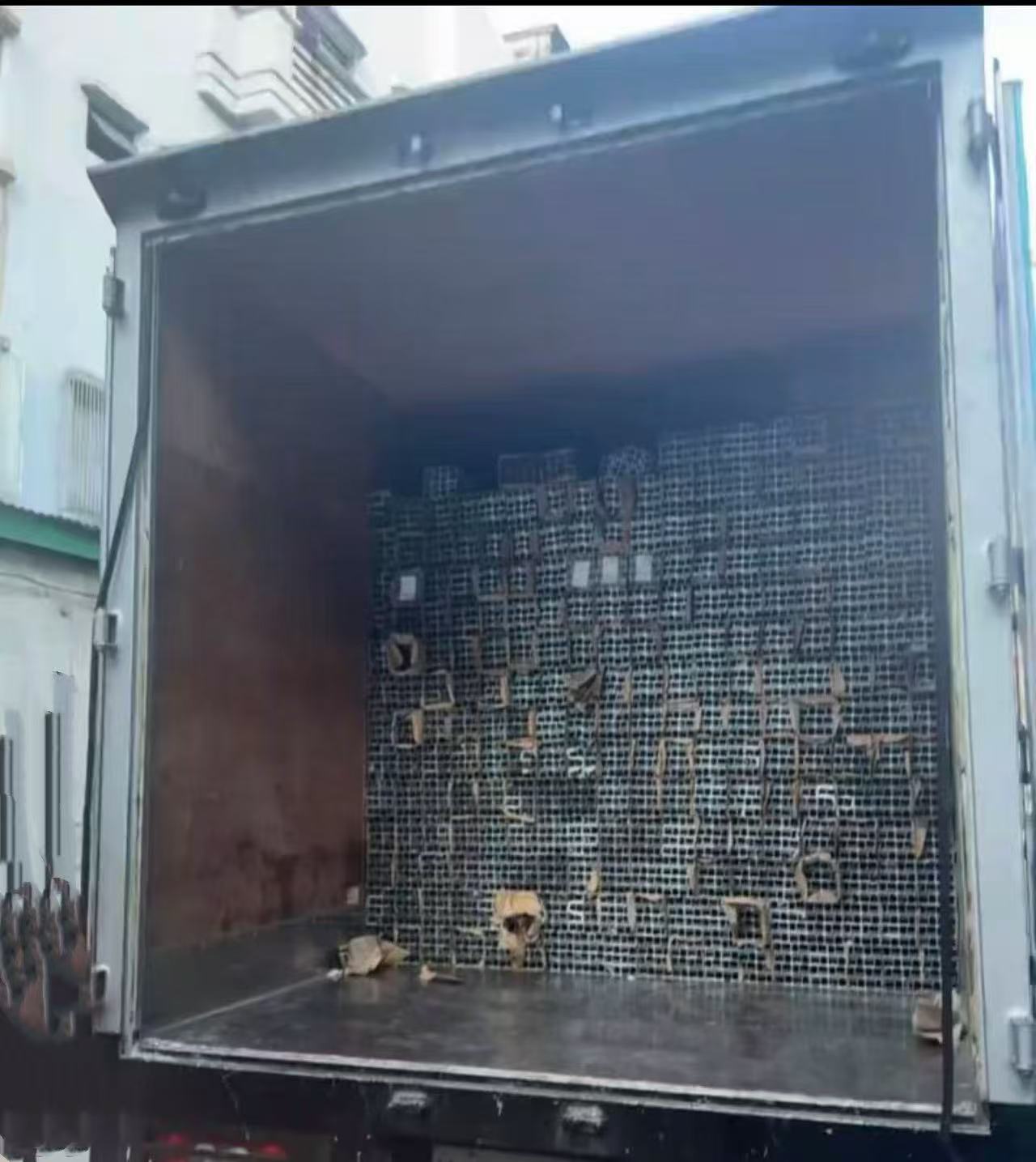 Aluminum solar mounting rails loaded into a container for export shipment